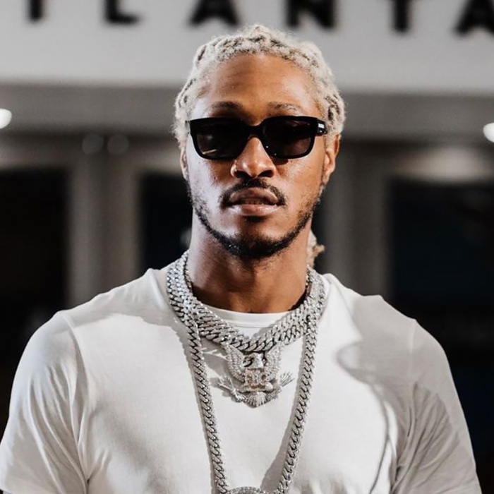 black man named future looks into the camera wears sunglasses and is photographed